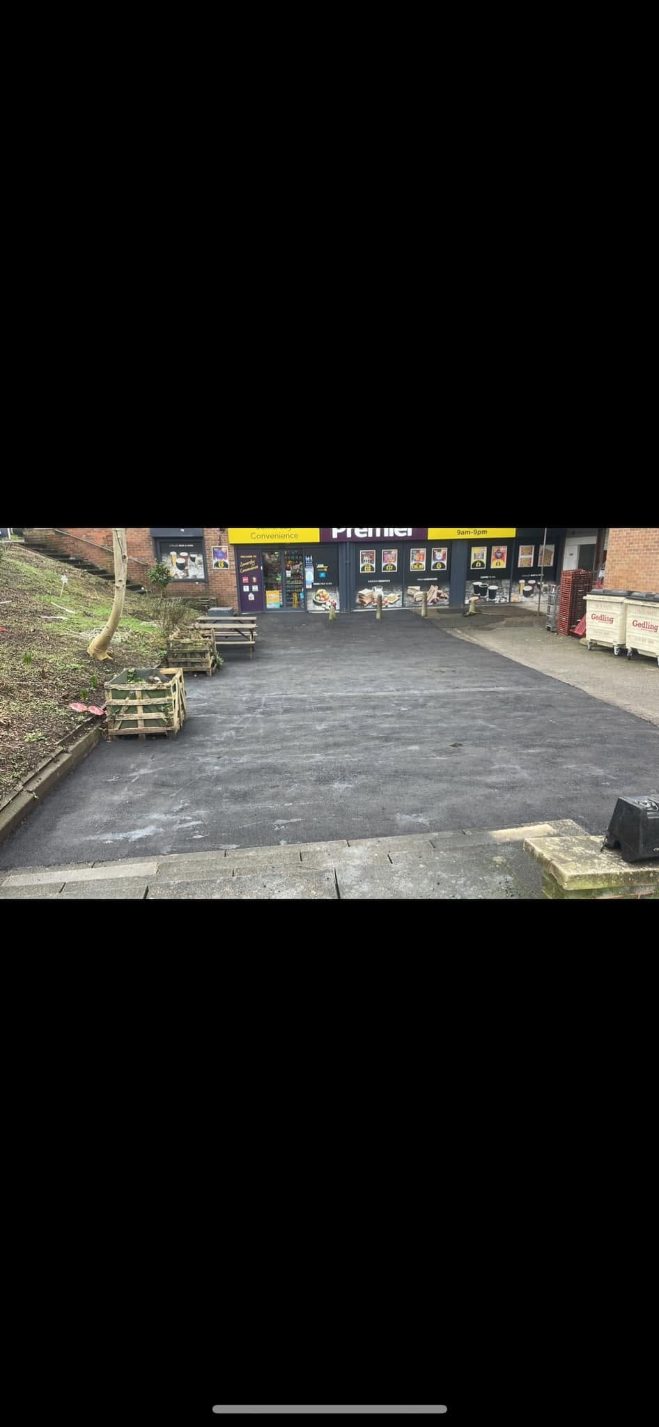 Resurfaced car park outside a Premier convenience store