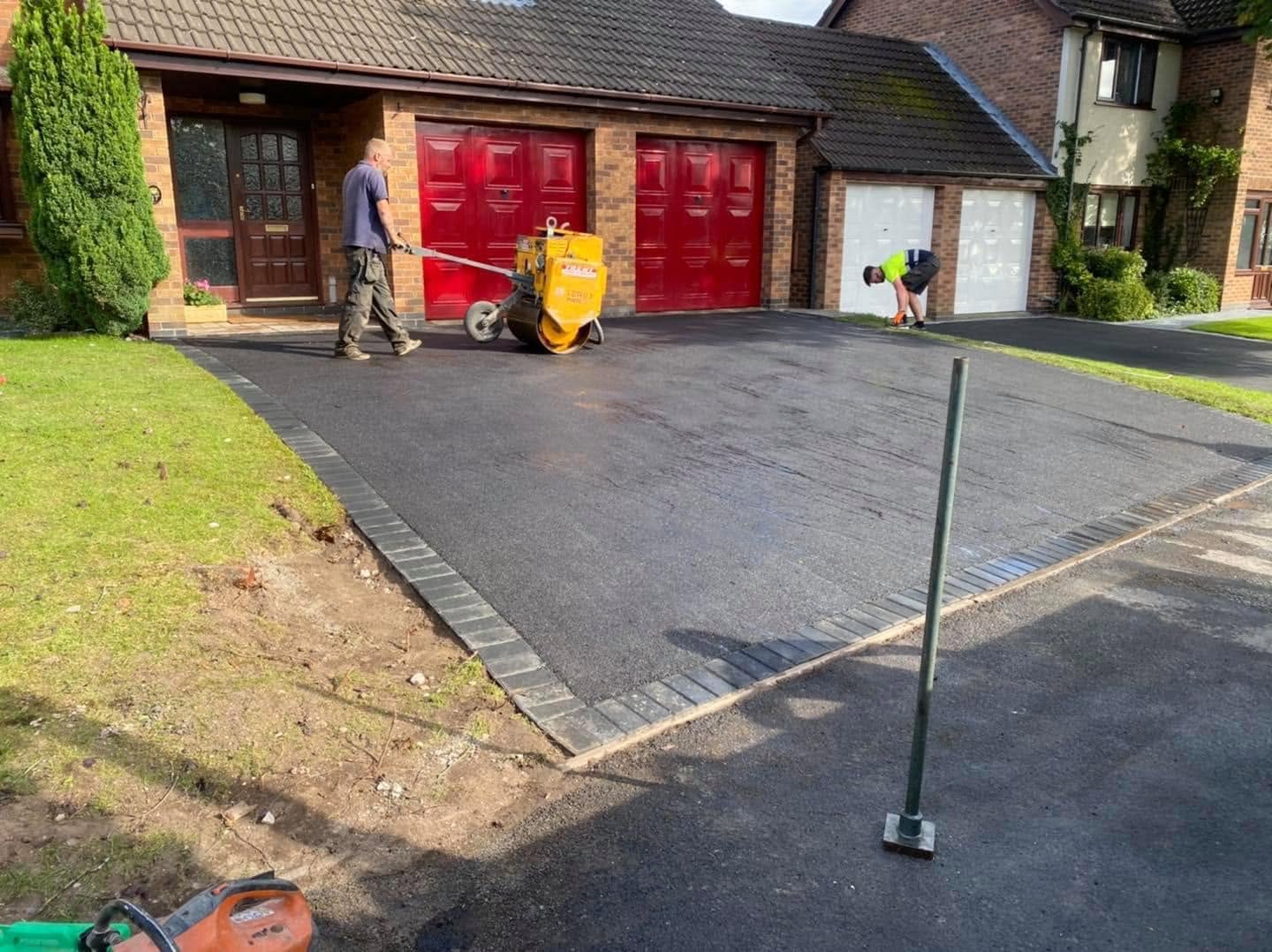 New tarmac driveway being laid at a residential property